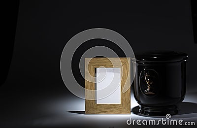 Black evangelical urn with blank mourning frame, Stock Photo