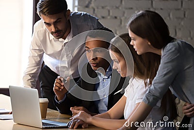 Black executive manager explaining to colleagues new online project Stock Photo