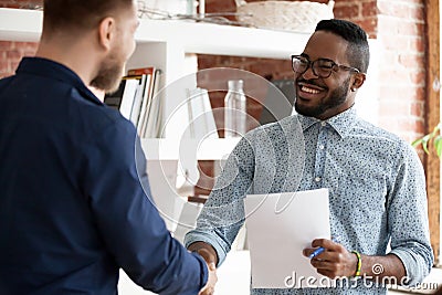 Black executive manager greeting company client starting business meeting Stock Photo