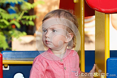 Black eyed children playing outside playground, peculiar kid in park, happy childhood. Stock Photo