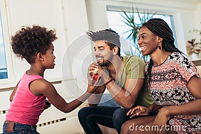 Black family enjoy singing karaoke Stock Photo