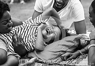 Black family enjoying summer together at backyard grayscale Stock Photo