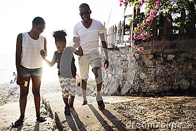 Black family enjoying summer together at the beach Stock Photo