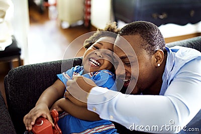 Black father enjoy precious time with his child together happiness Stock Photo