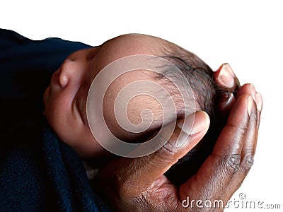 Black father holding newborn baby`s head in his hands. Stock Photo