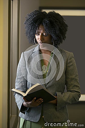 Black African American Female Businesswoman with a Book Stock Photo