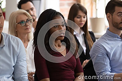 Black female professional ask question at group seminar lecture event Stock Photo