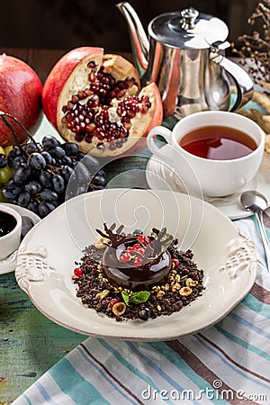 Black Forest chocolate dessert with cup of tea on textile napkin Stock Photo