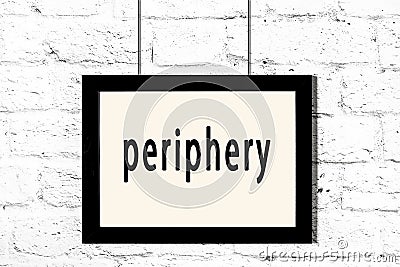Black frame hanging on white brick wall with inscription periphery Stock Photo