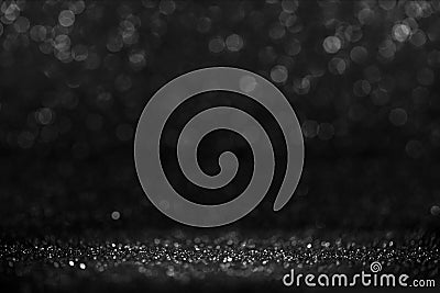 Black friday bokeh background. Elegant dark blur layout design. Silver and black glitter place on table with spotlight. Luxury Stock Photo