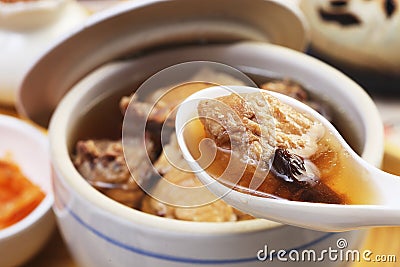 Black garlic chicken soup Stock Photo