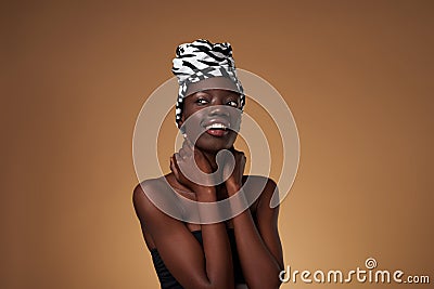 Black girl wearing african turban looking away Stock Photo