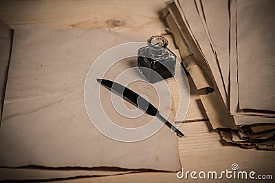 Feather and old papers Stock Photo