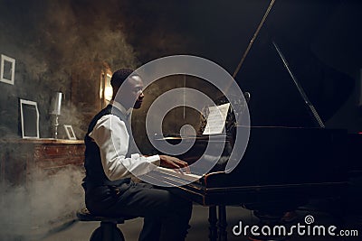 Black grand piano player, jazz performance Stock Photo