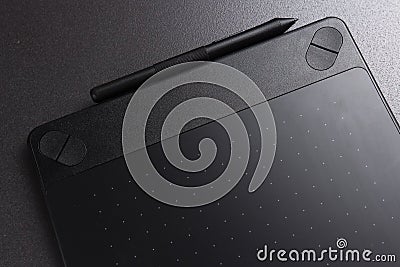 Black graphic tablet. Designer tool for drawing. Stock Photo