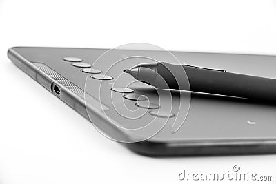Black graphic tablet with pen for illustrators, designers and photographers, isolated on white background Stock Photo
