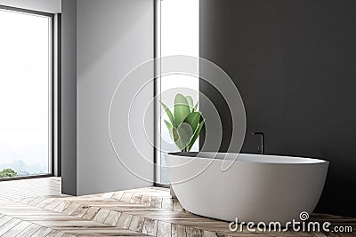 Black and gray bathroom corner, white tub Stock Photo