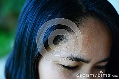 Black hair ,hairline and eyebrows of adult asian woman Stock Photo