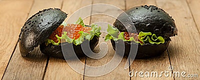 Black hamburger with caviar Stock Photo