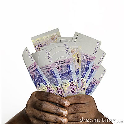 Black hands holding 3D rendered 10000 west African Cfa franc notes. closeup of Hands holding Cfa franc currency notes Stock Photo