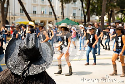 Black hat on flash mob backgroung Stock Photo