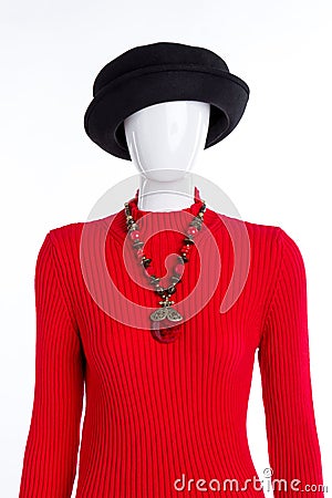 Black hat, red sweater and necklace. Stock Photo