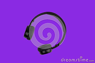 Black headphones isolated on trendy proton purple color background. Music minimal concept Stock Photo