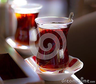 Black herbal turkish tea in traditional glass Stock Photo