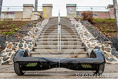 Black hoverboard against the background of stairs Stock Photo