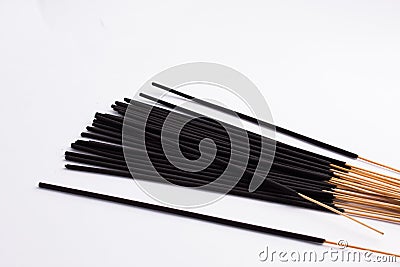 Bunch of black Incense sticks isolated on white background Stock Photo