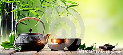 Black Iron Asian Teapot and Cups Stock Photo