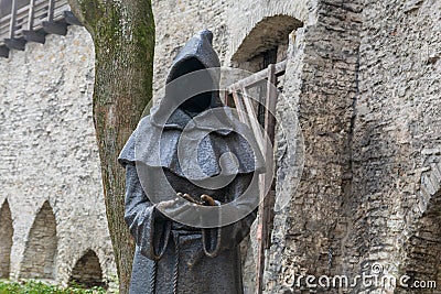Black iron statue of a faceless monk in Tallinn. Editorial Stock Photo