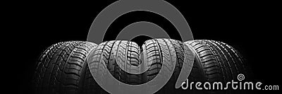 a black isolation rubber tire, on the black backgrounds Stock Photo