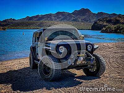 Black Jeep Wrangler off-roading on Arizona trails near a lake Editorial Stock Photo