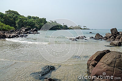 Black Johnson Beach in Sierra Leone, Africa with calm sea, ropcks, and deserted beach Stock Photo