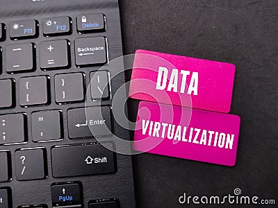 Black keyboard and colored board with the word Data Virtualization - Business concept Stock Photo