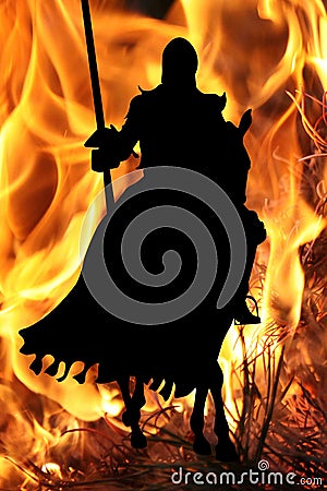 Black Knight on a horse on a flame background Stock Photo