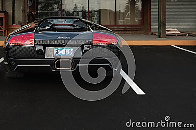 Black Lamborghini Gallardo parked on a street of Vancouver. Sport car Lamborghini outdoor. View of Lamborghini supercar Editorial Stock Photo