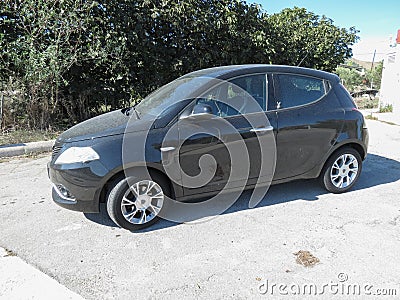 Black Lancia Ypsilon car in Cagliari Editorial Stock Photo