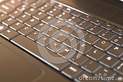 Black laptop computer keyboard close up. Mobile, portable devices concept. Stock Photo