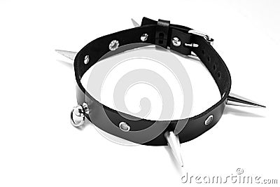 Black leather collar with spikes on a white background. Stock Photo