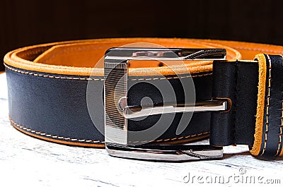 Black leather men`s belt with silver buckle, close up Stock Photo