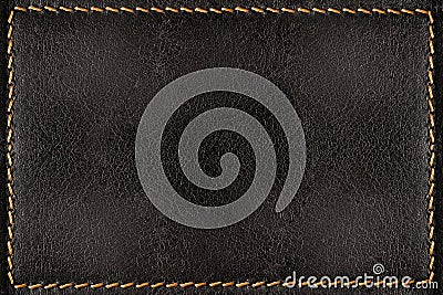 Black leather texture background with orange seams Stock Photo