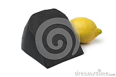 Black lemon cheese and a fresh yellow lemon Stock Photo