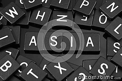 Black letter tiles spelling the word & x22;asia& x22; Stock Photo