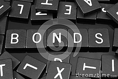 Black letter tiles spelling the word & x22;bonds& x22; Stock Photo