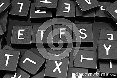 Black letter tiles spelling the word & x22;ETFs& x22; Stock Photo