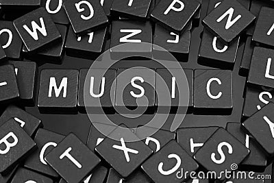 Black letter tiles spelling the word & x22;music& x22; Stock Photo