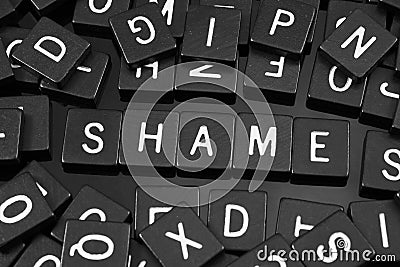 Black letter tiles spelling the word & x22;shame& x22; Stock Photo