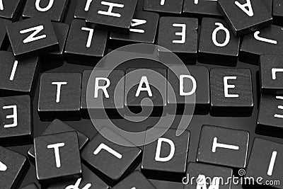 Black letter tiles spelling the word & x22;trade& x22; Stock Photo